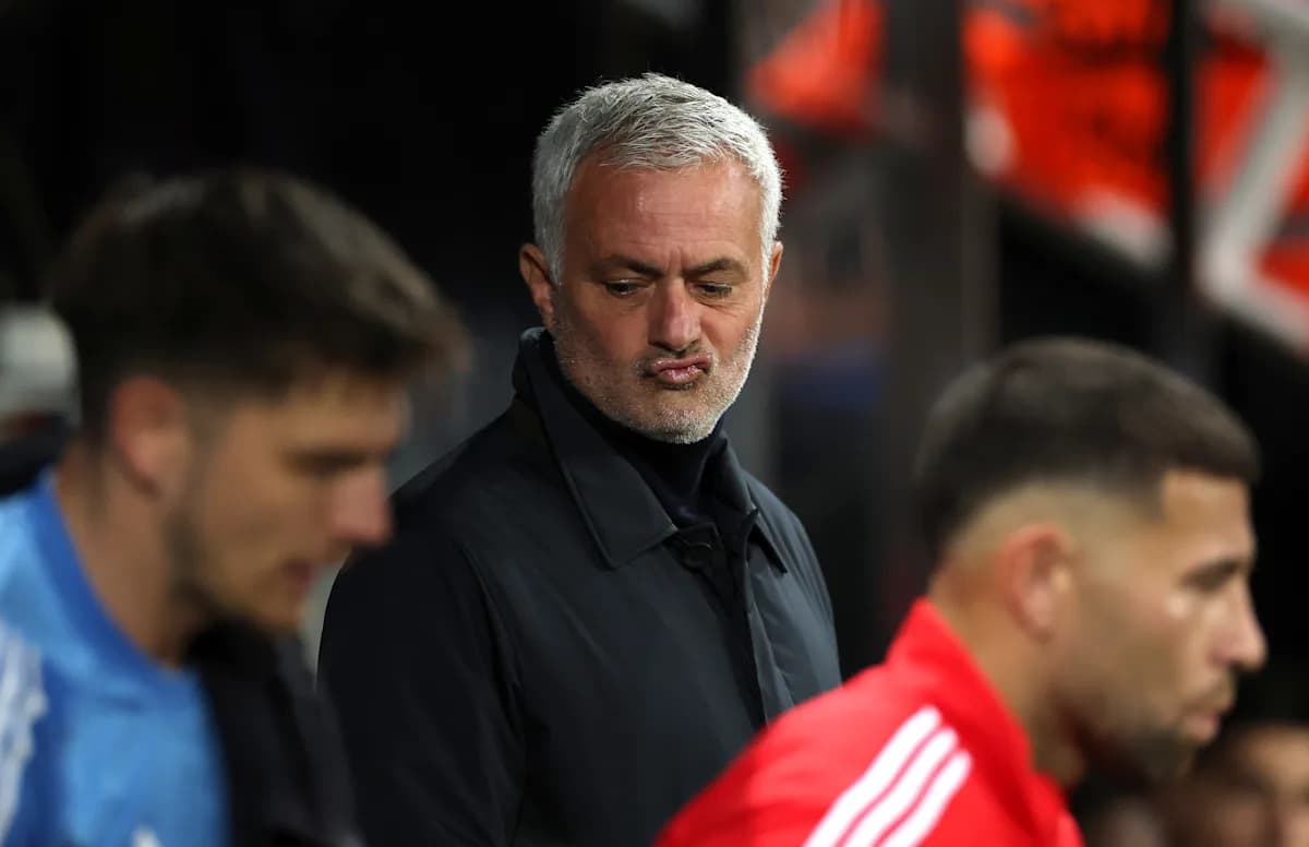 Manager observing players on the sidelines