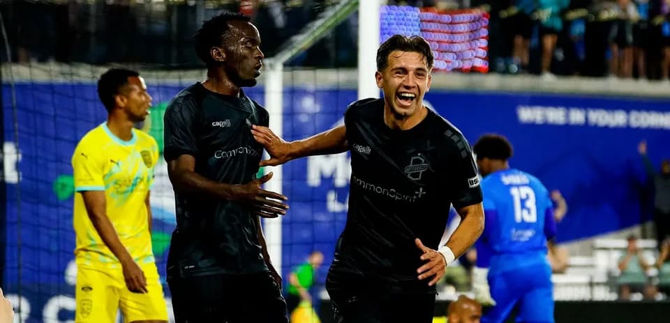Players celebrating a goal during match