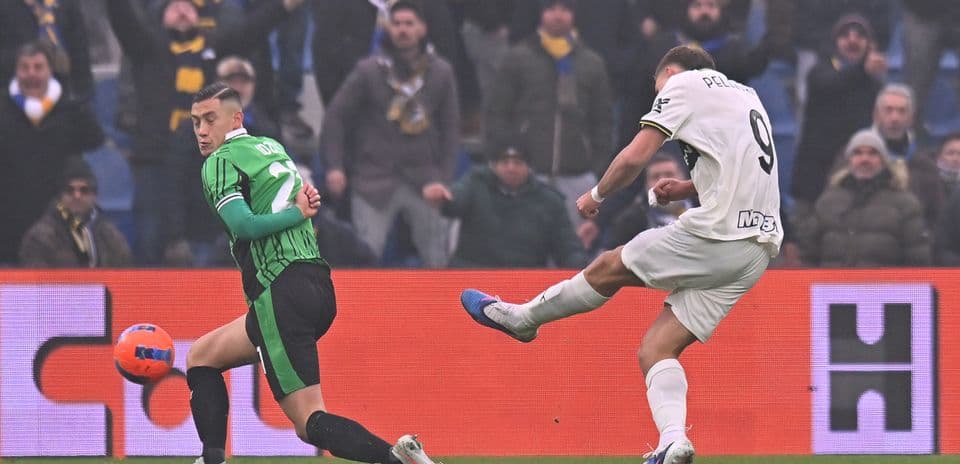 Parma player shooting at goal against Sassuolo