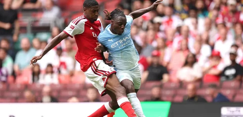 Players contesting for the ball during match