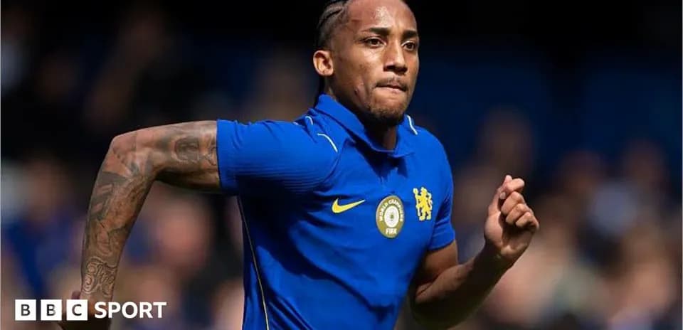 Player in blue jersey running on the field