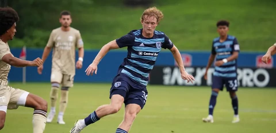 Player dribbling during Sporting KC II match