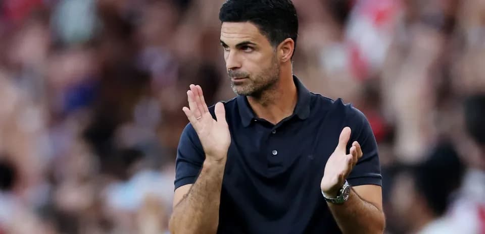 Coach clapping during a match on the sidelines