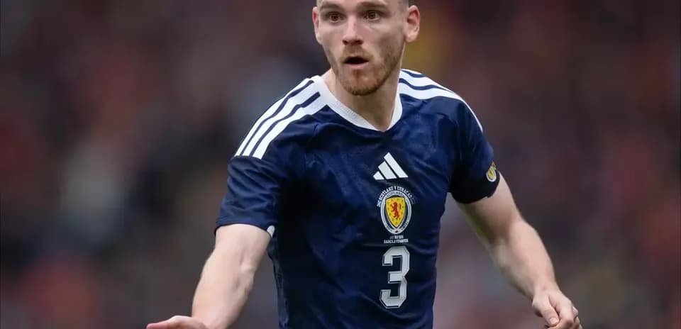 Player in Scotland jersey gesturing during match