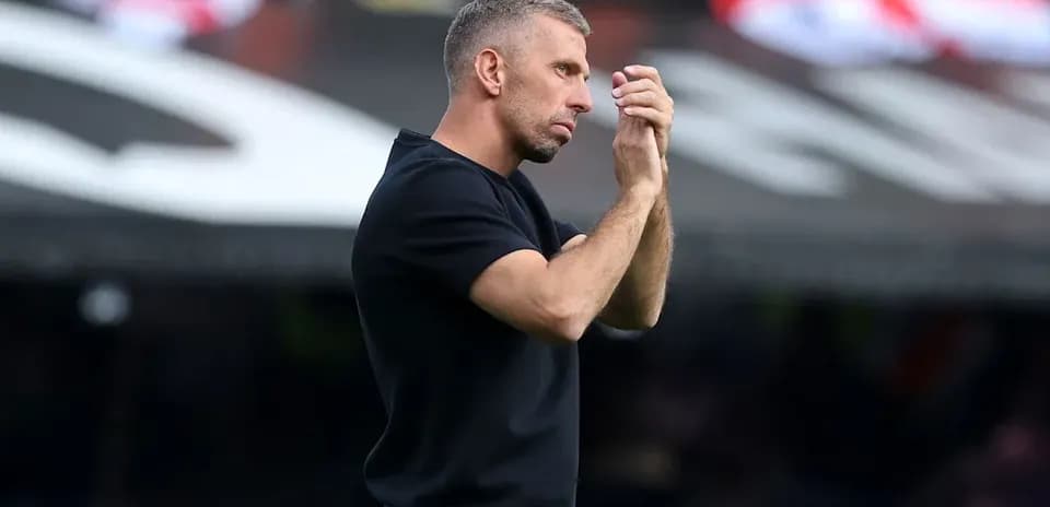Coach gesturing during a match on the sidelines