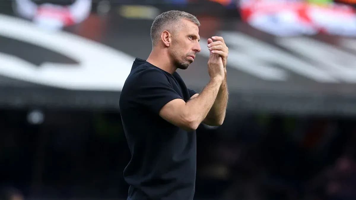Coach gesturing during a match on the sidelines