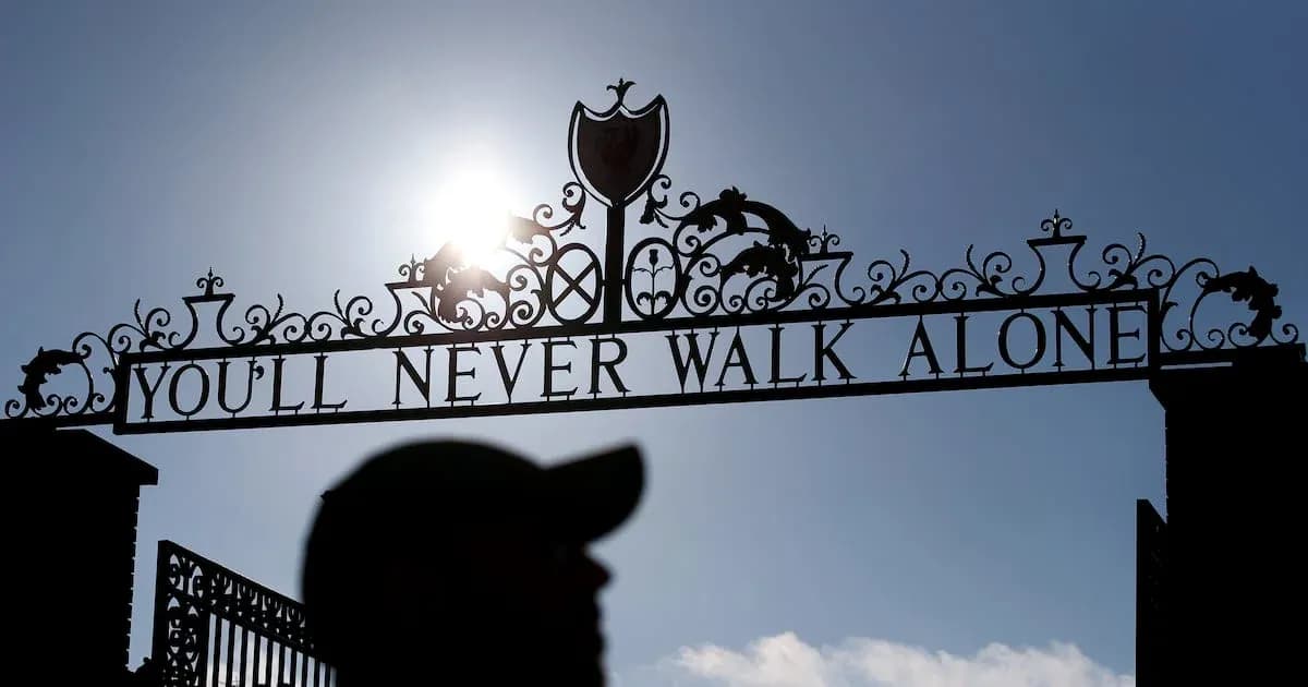 Sign saying 'You'll Never Walk Alone' with silhouette
