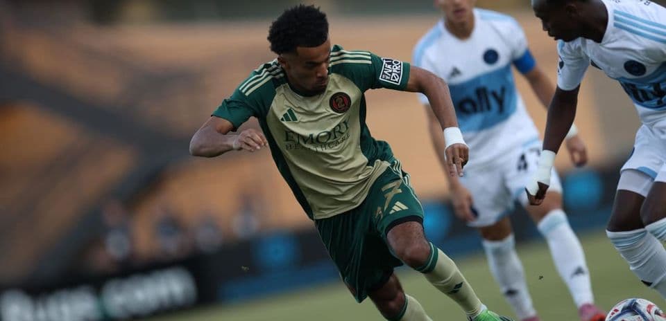 Atlanta United II player dribbling against opponent