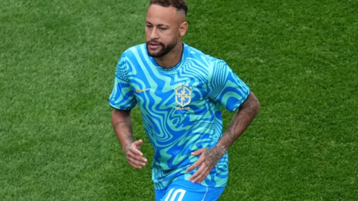 Neymar running on the field in Brazil kit
