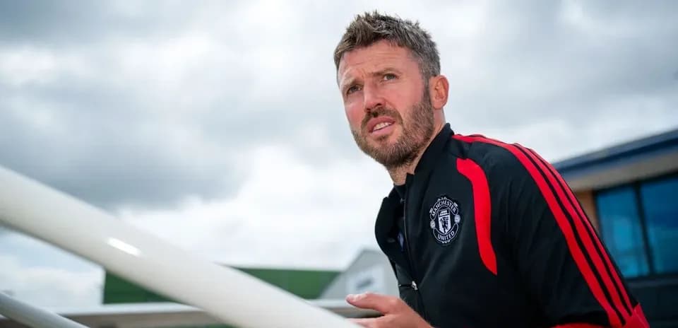 Coach walking up stairs at training facility