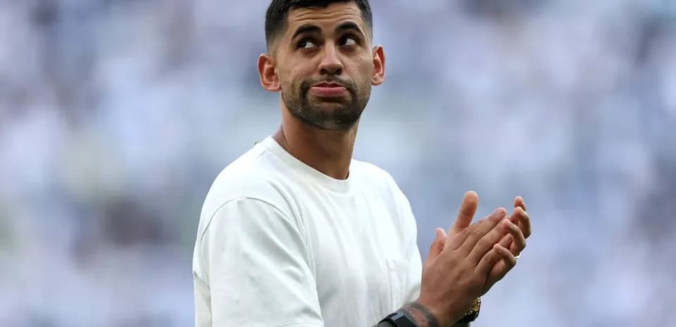 Player clapping during pre-match warm-up on field