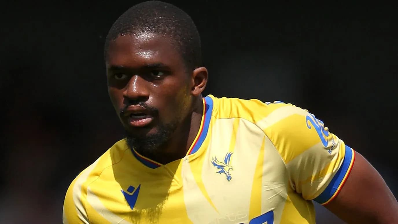 Player in yellow jersey running during a match
