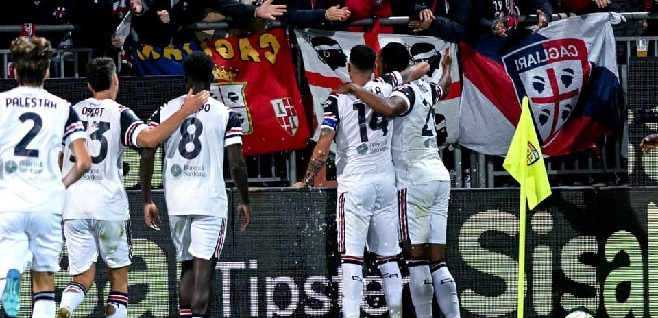 Cagliari players celebrating with fans
