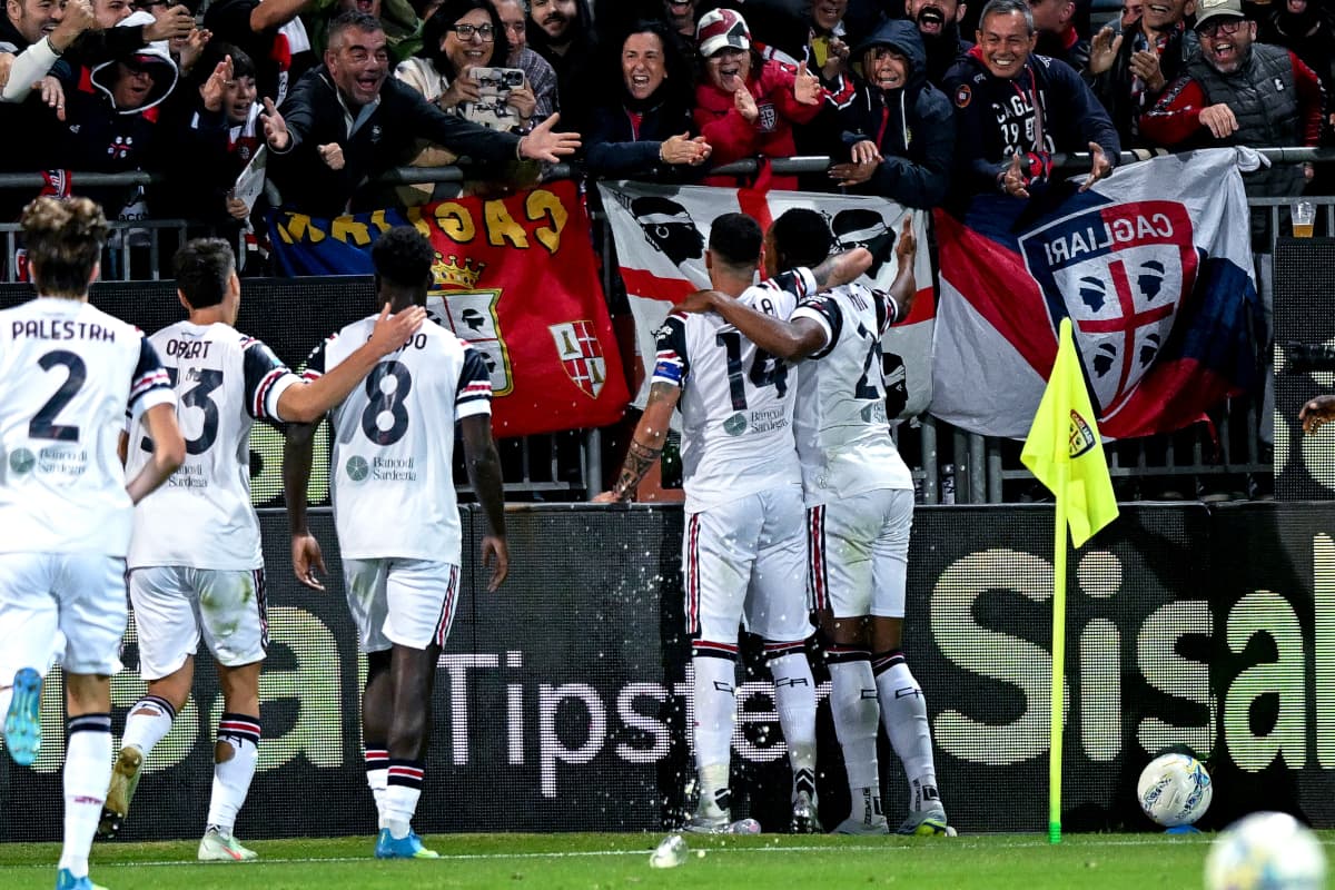 Cagliari players celebrating with fans