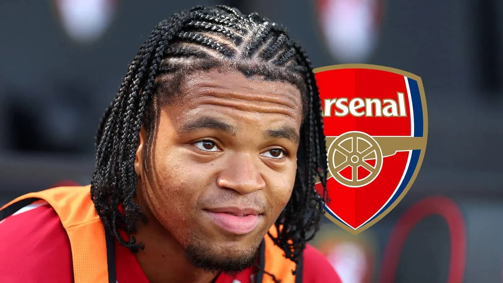 Player with braided hair wearing Arsenal training kit