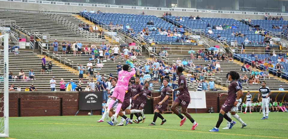 Goalkeeper catching ball during Carolina Core match