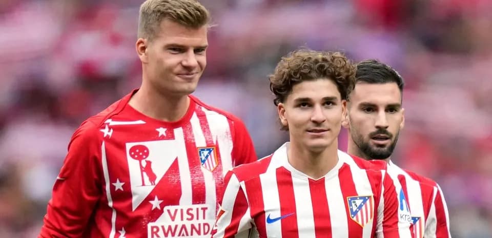 Atletico Madrid players in team warm-up attire