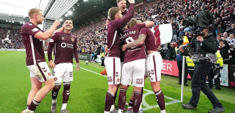 Hearts players celebrating a goal at Tynecastle Stadium
