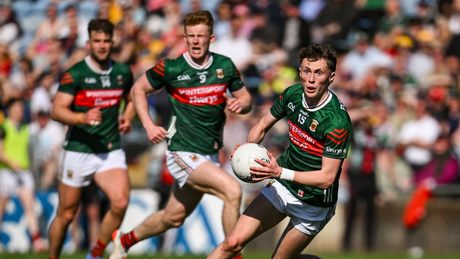 Mayo player running with the ball during match