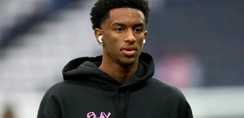 Player wearing headphones during pre-game warm-up