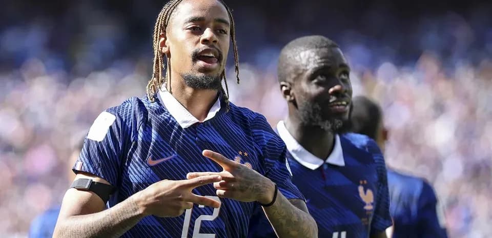 Two French players celebrating on the field