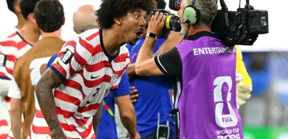 Player celebrating and interacting with cameraman post-match