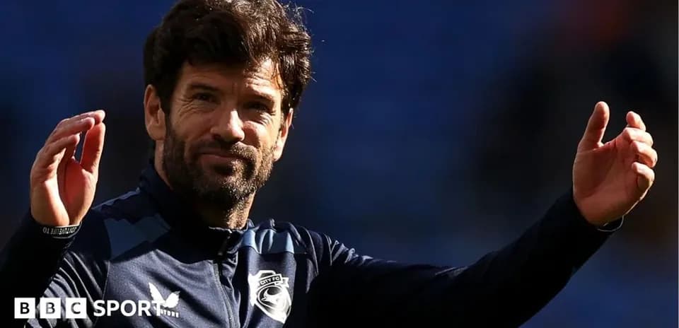 Coach gesturing during training session on field