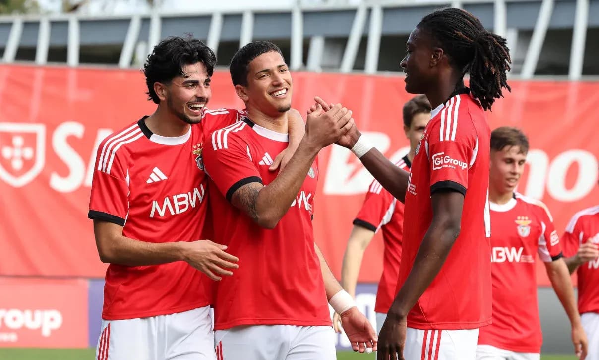 Benfica players celebrating together on the field