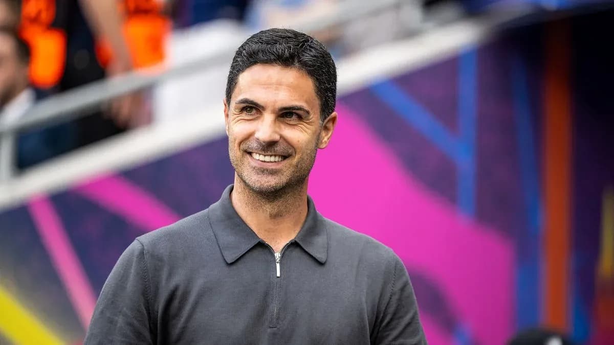 Manager smiling before a match at the stadium