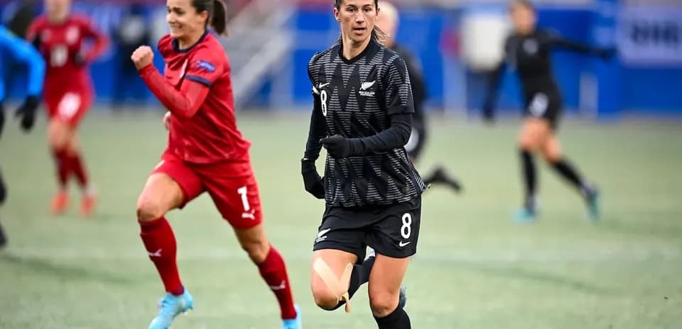 New Zealand player running with ball during match