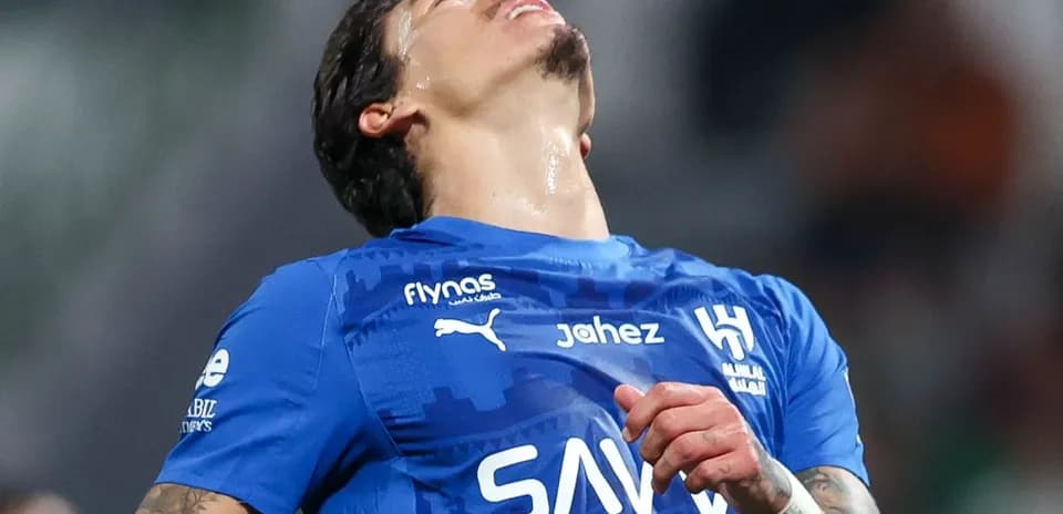 Player in blue jersey reacting on the field