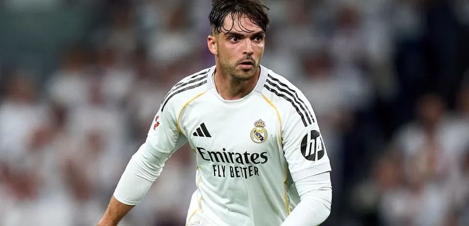 Player in white Real Madrid kit during match