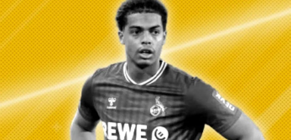 Player wearing REWE jersey against yellow background