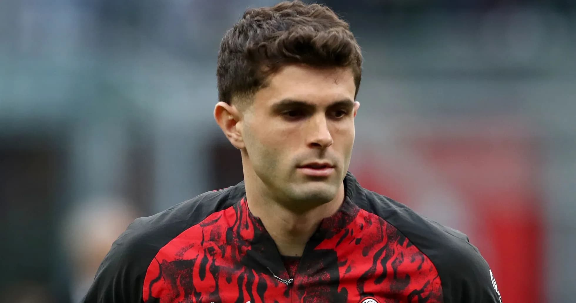 Player in red and black jersey during match