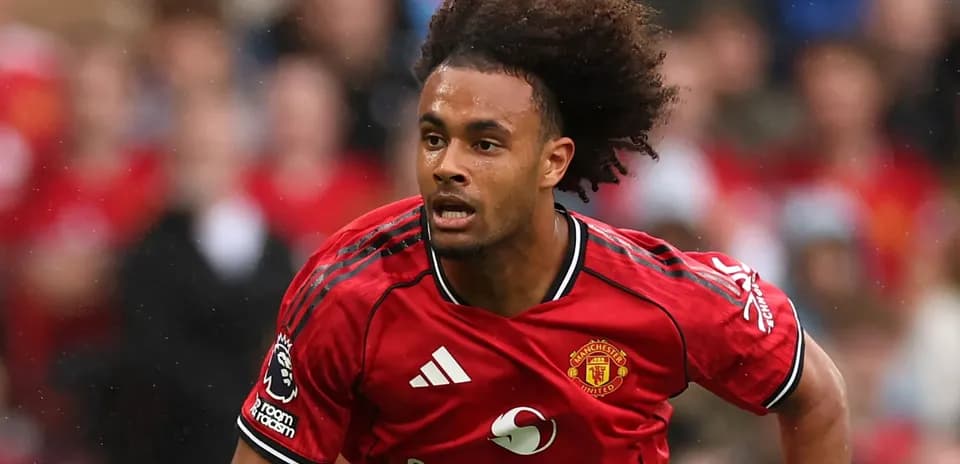 Player running in Manchester United kit during match