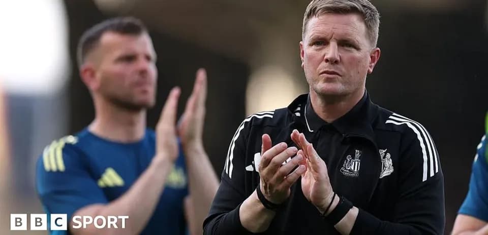Manager applauding with team members in background