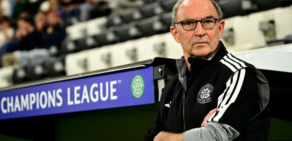 Coach observing match from technical area during Champions League