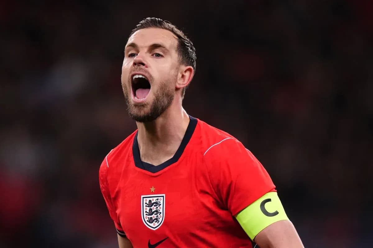 Player celebrating in red England jersey with captain's armband