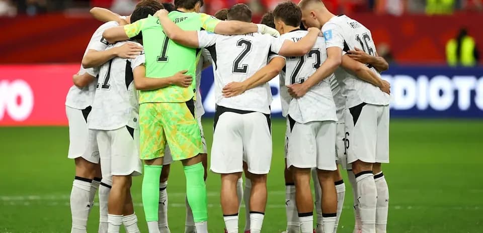 Team huddling before the match on the field