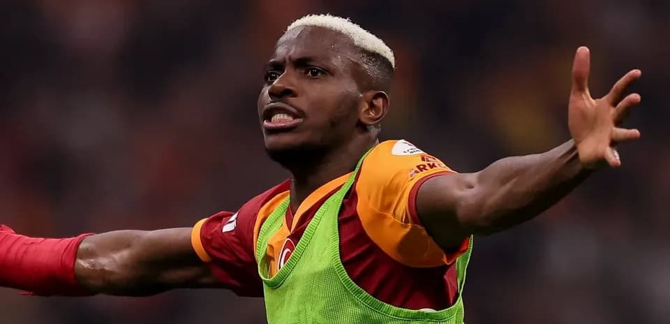 Player celebrating a goal wearing Galatasaray jersey