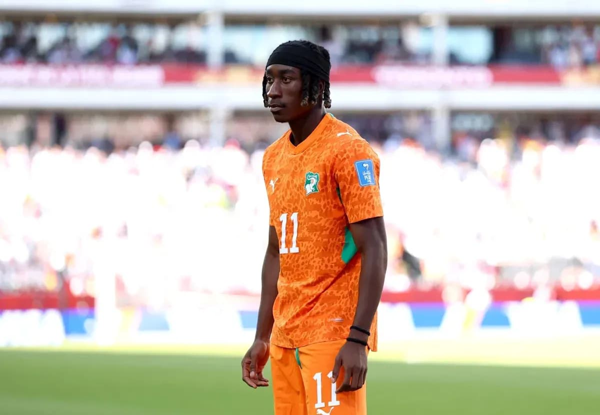 Player wearing orange jersey during match warm-up