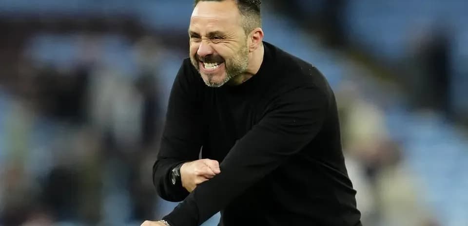 Coach celebrating a victory on the sidelines