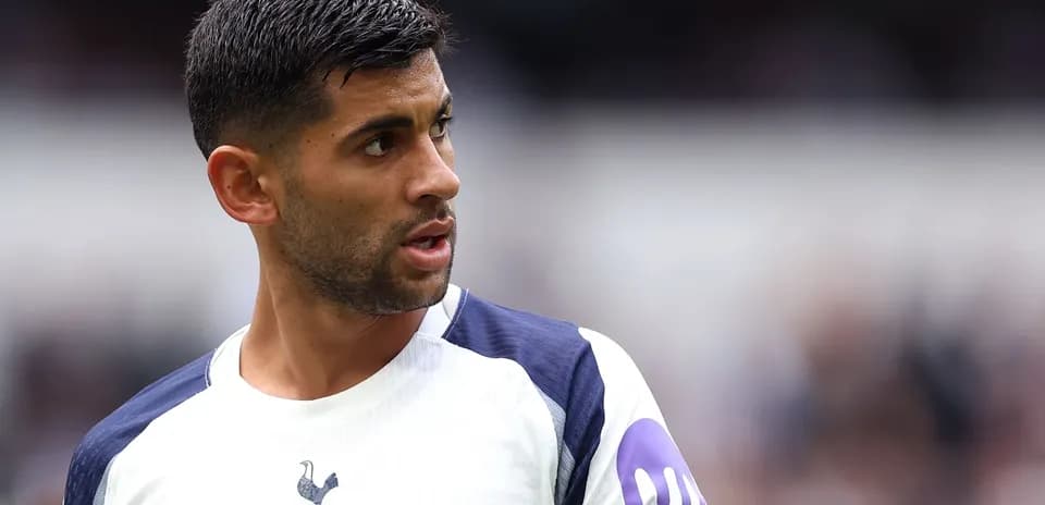 Player in Tottenham kit looking towards the side