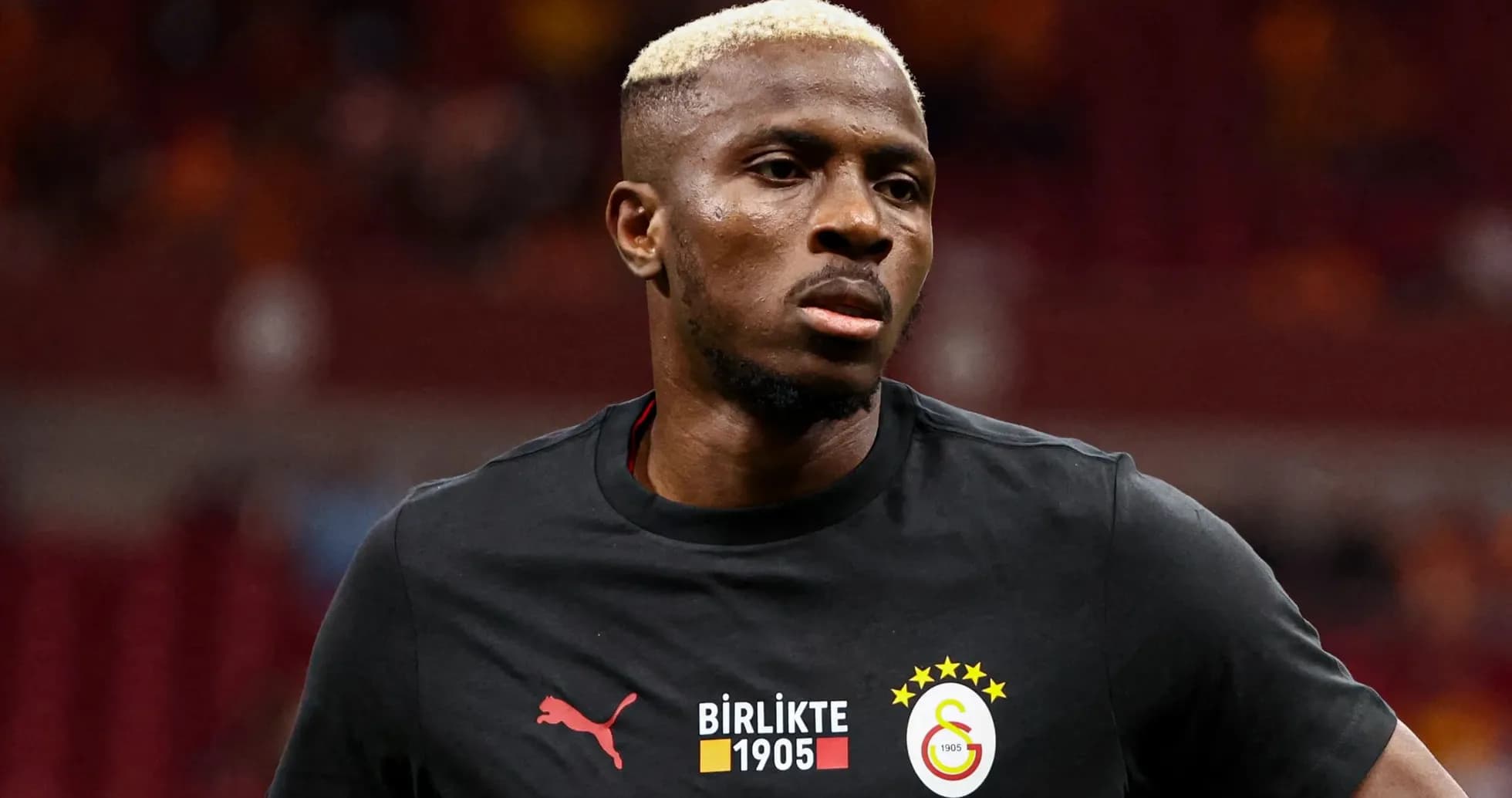 Player in Galatasaray warm-up shirt on field