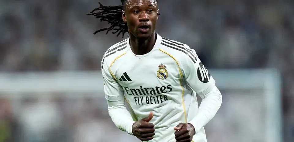 Player running on the field in Real Madrid kit