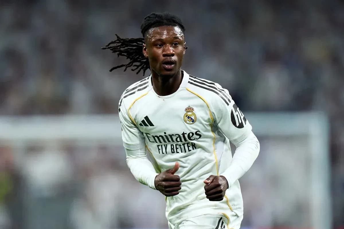Player running on the field in Real Madrid kit