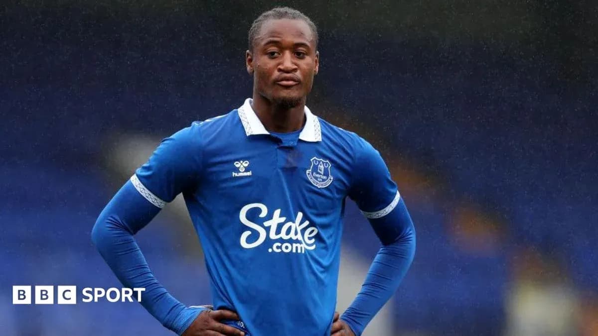 Player in blue Everton kit on the pitch
