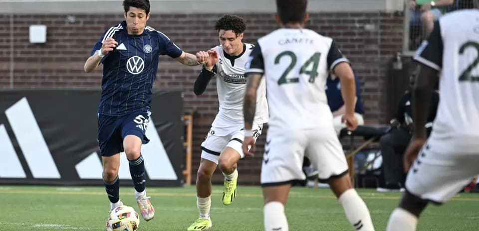 Player dribbling past opponent during match