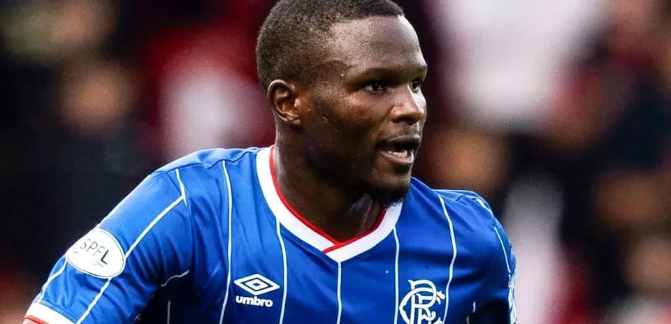 Player wearing blue Rangers jersey during match