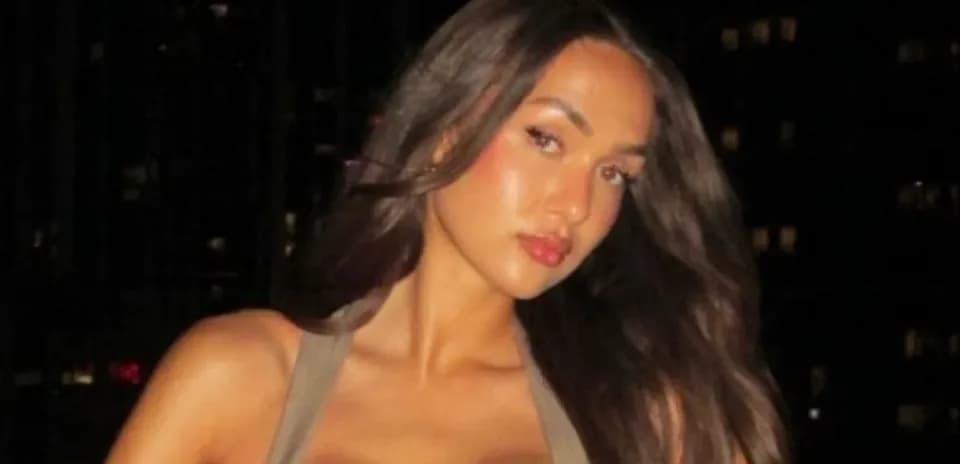 Person posing with long hair at night
